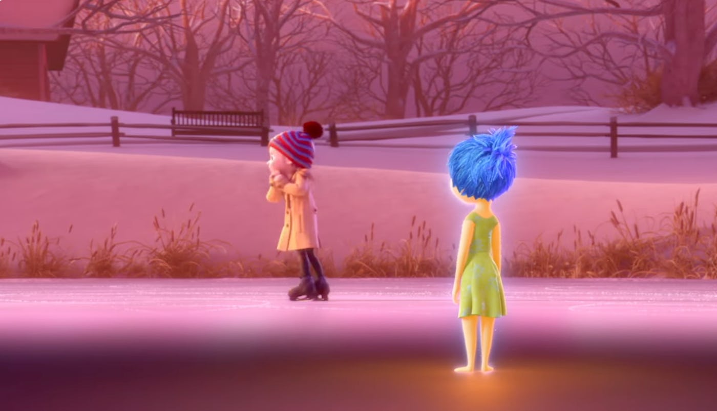 A scene from 'Inside Out' in which Riley, in a dream, ice skates at sunset as Joy looks on wistfully.