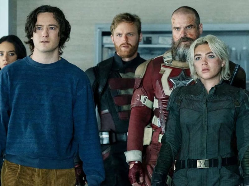 A group of six characters stands together, showcasing a mix of casual and tactical outfits, with ser...