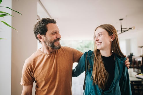 Father telling dad jokes to his daughter as they walk.
