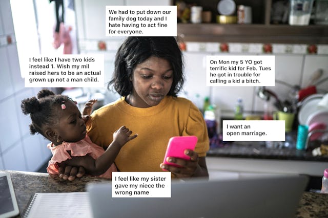 A woman holds a baby while using a phone, sitting at a table with a laptop, surrounded by notes depi...