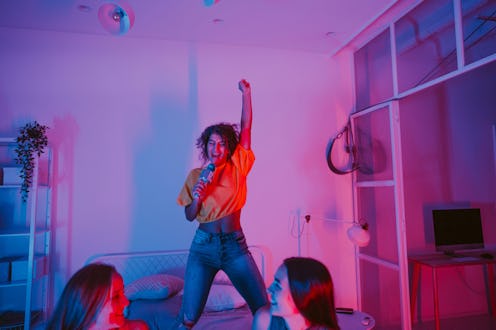 Girls asking each other the best truth or dare questions on a girls' night in
