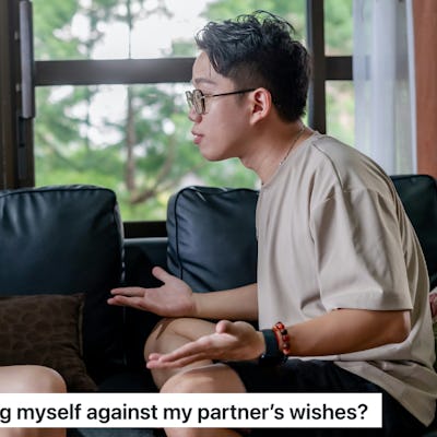 A couple sits on a couch in a living room, engaged in a serious discussion. A woman is wondering if she can get her tubes tied even though her husband doesn't want her to.