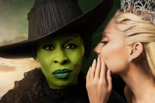Glinda whispers in Elphaba's ear, in a promotional image for Wicked the movie.