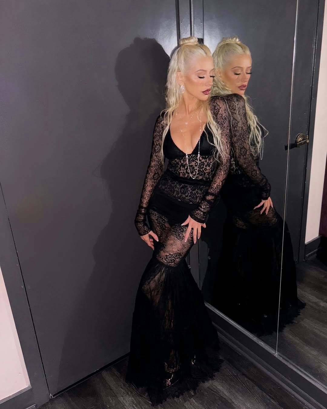 Christina Aguilera wears a black lace set.