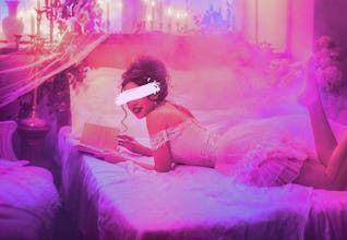 a woman reading a spicy BookTok novel filled with castlecore sex