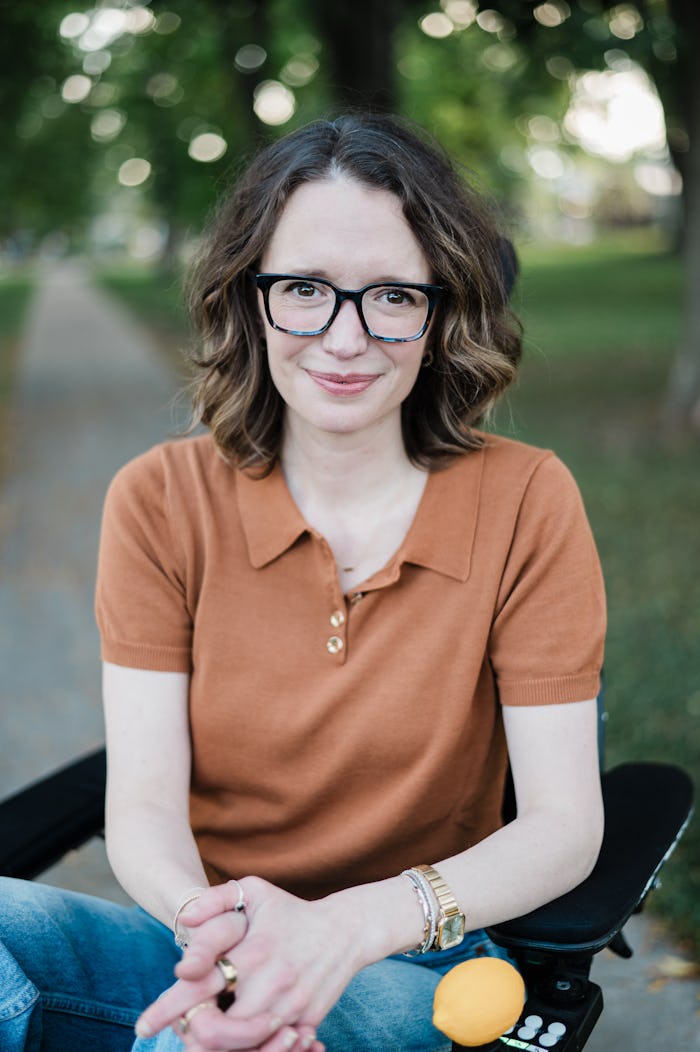 photo of Jessica Slice in her motorized wheelchair, smiling at camera