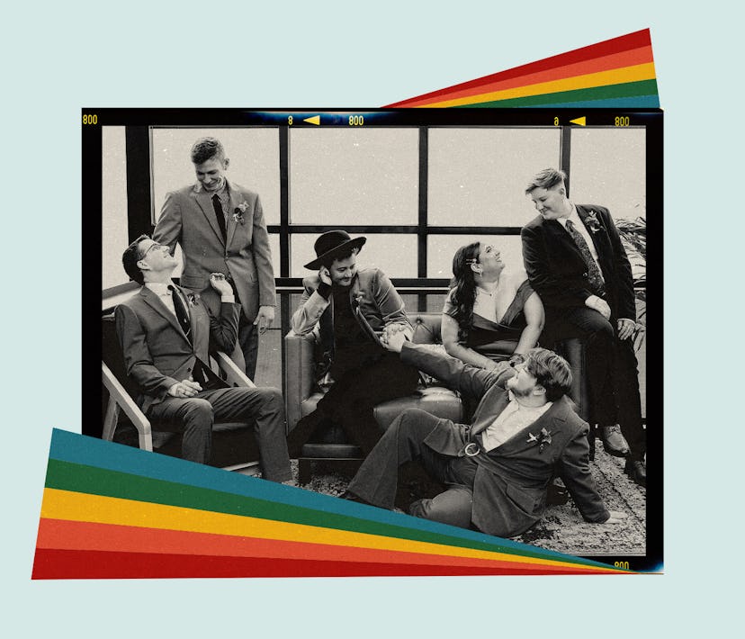A queer wedding party poses together in tuxedos and dresses