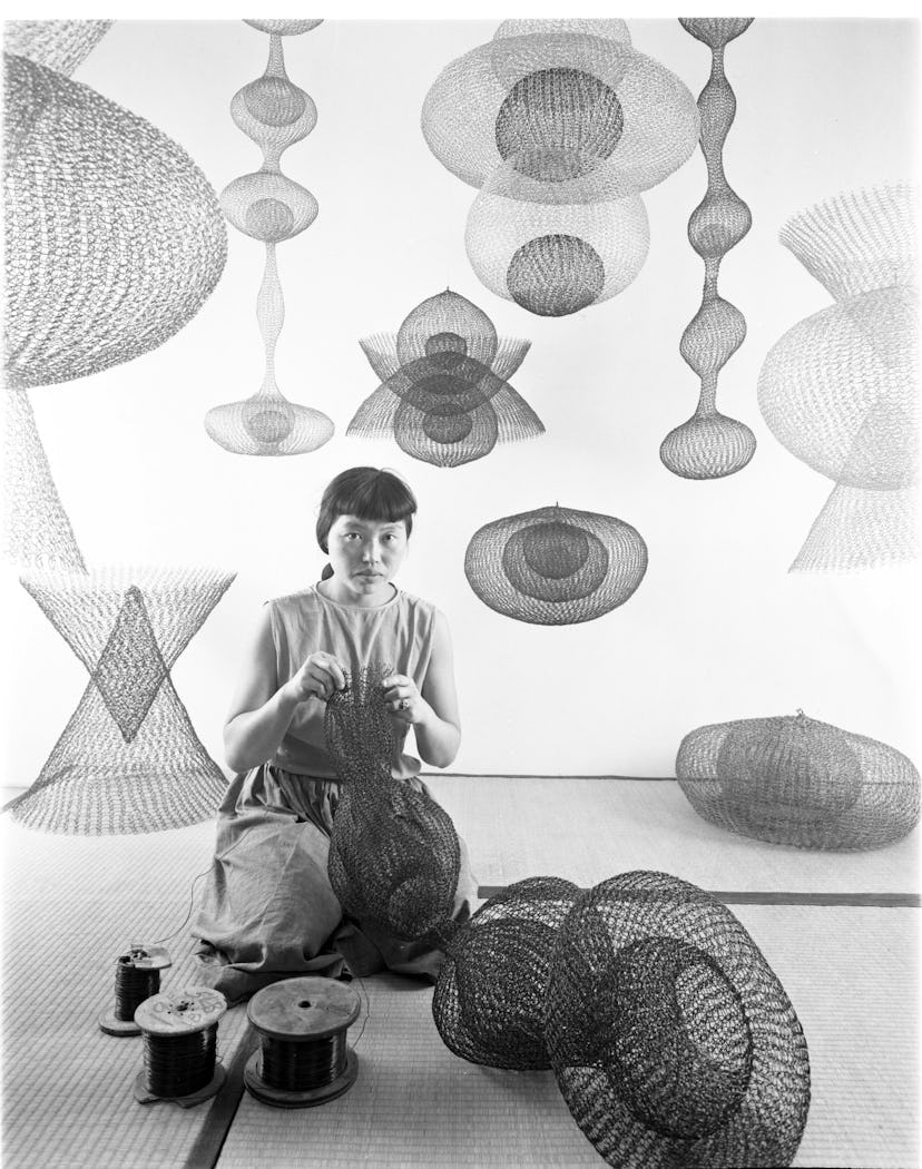 Ruth Asawa with her works
