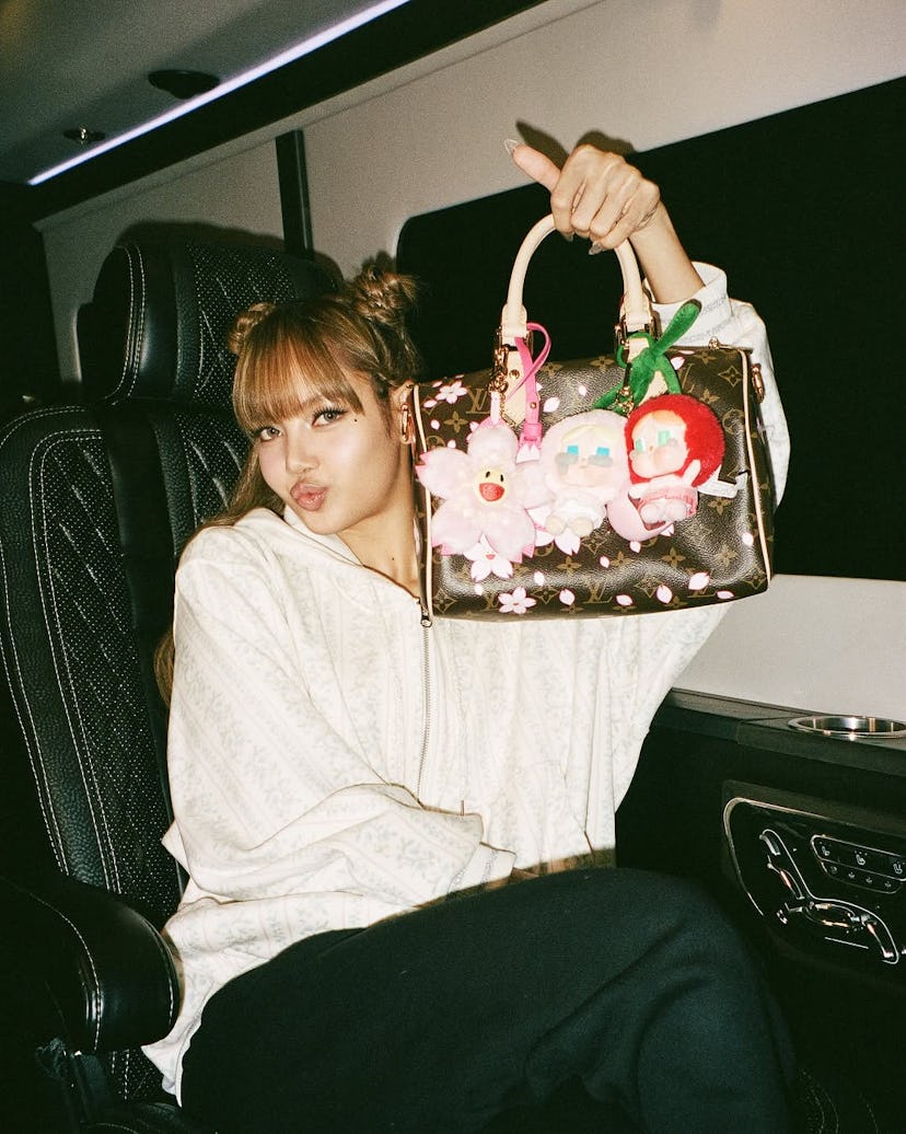 Lisa with her Louis Vuitton bag