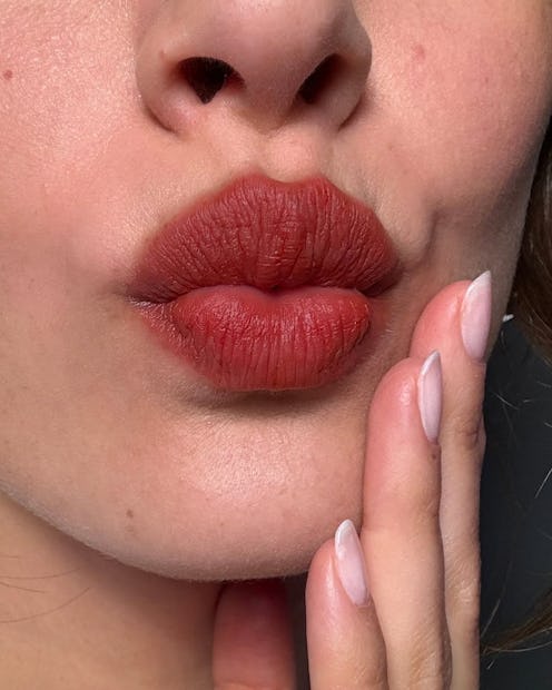 “Bitten lips” is the makeup trend you won’t have to touch up.