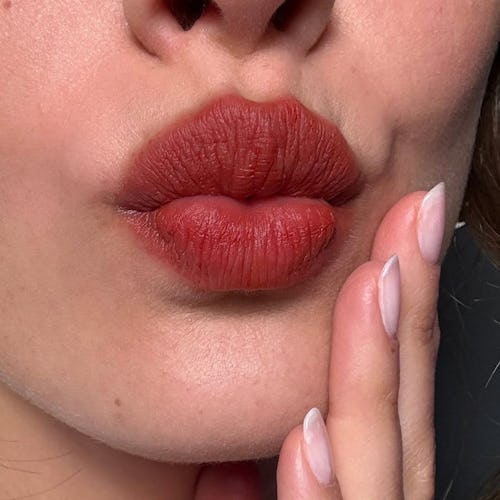 “Bitten lips” is the makeup trend you won’t have to touch up.
