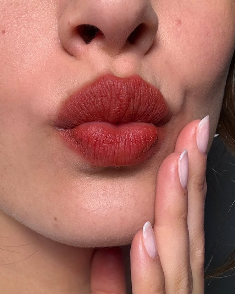 “Bitten lips” is the makeup trend you won’t have to touch up.