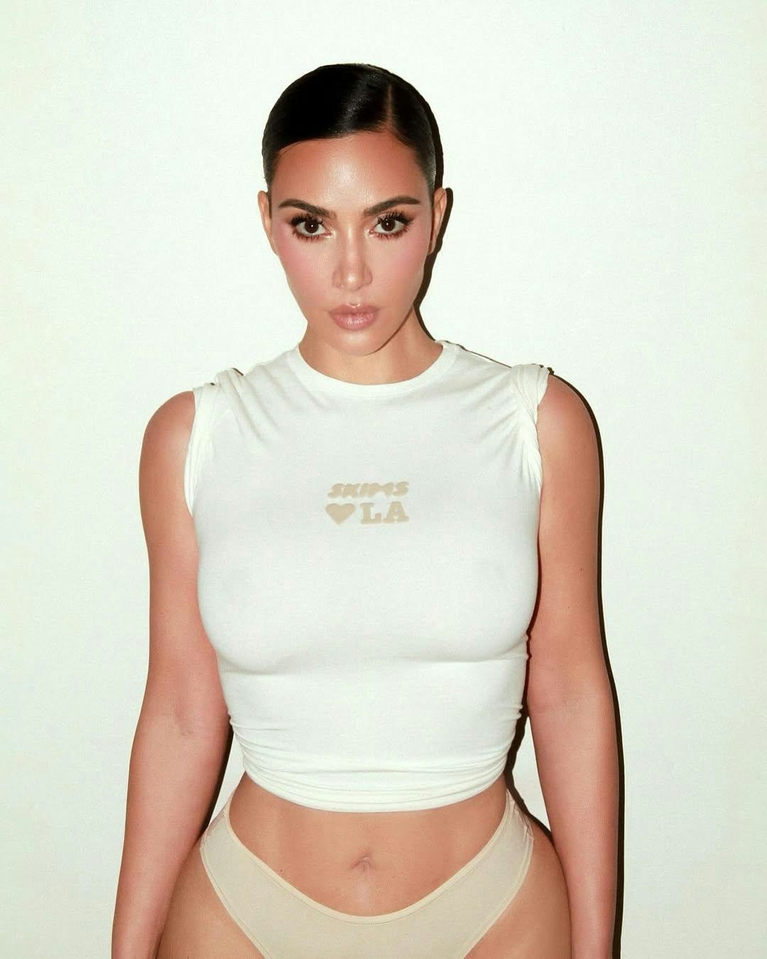 Kim Kardashian wears a shirt and undies.