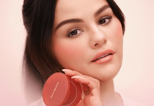 Selena Gomez holding Rare Beauty’s Soft Pinch Bouncy Blush.