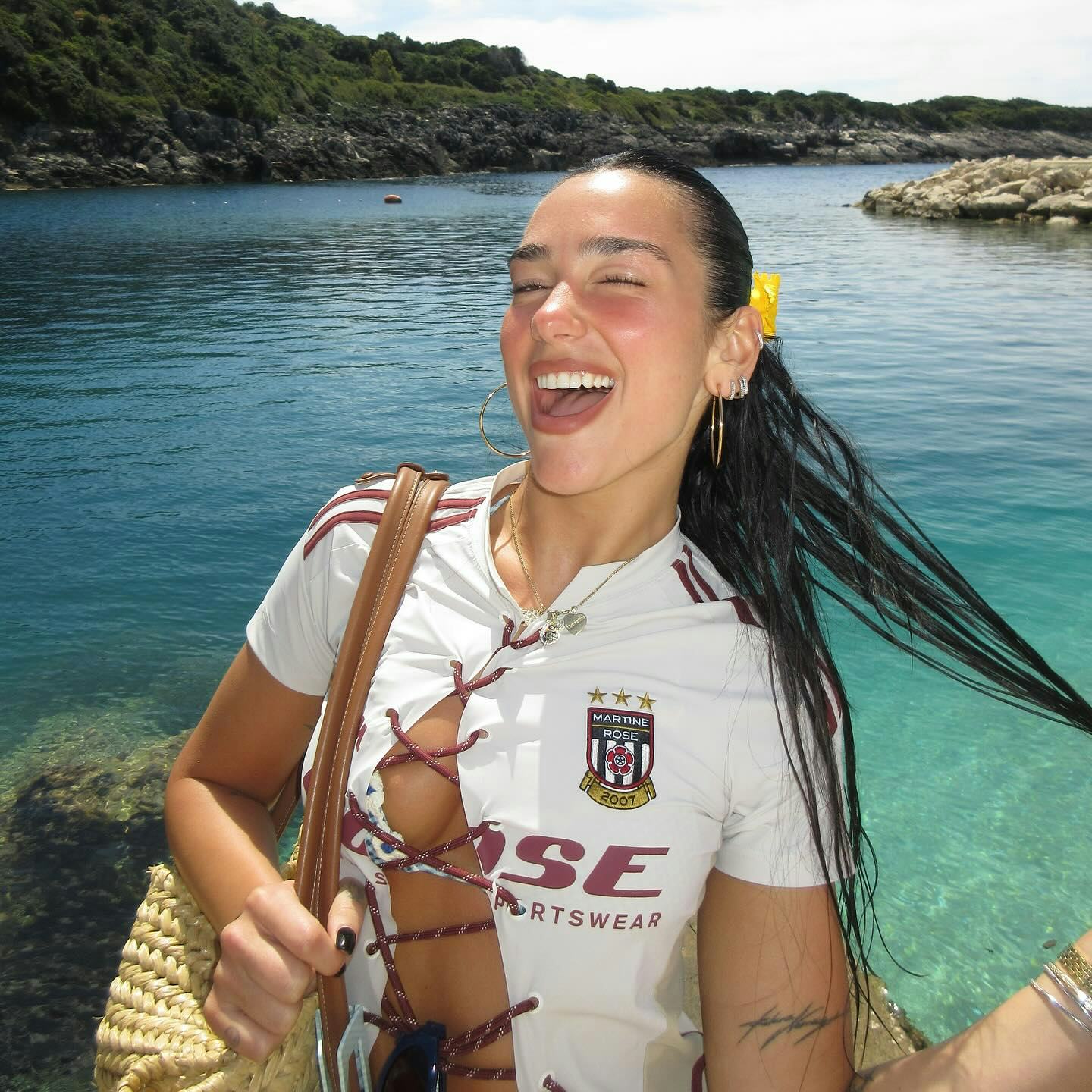 Dua Lipa wore multiple bikinis on vacation with boyfriend Callum Turner.