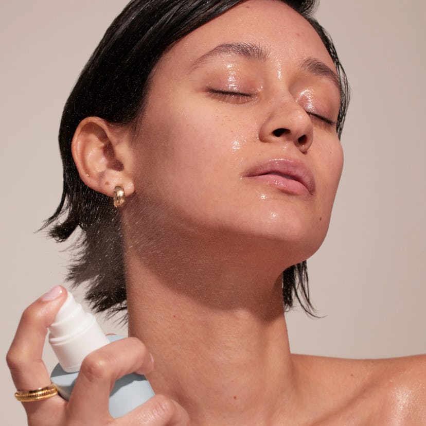 woman spraying thrive causemetics Moisture Flash Conditioning Toner Mist on her face