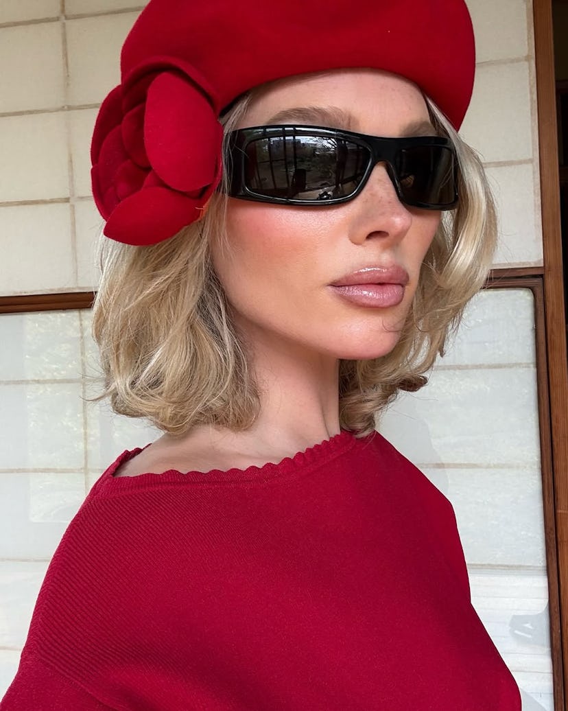 Elsa Hosk wears a red rosette beret.