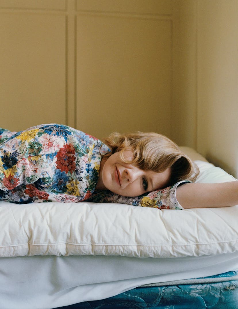 sandra hüller lying down in a floral dress