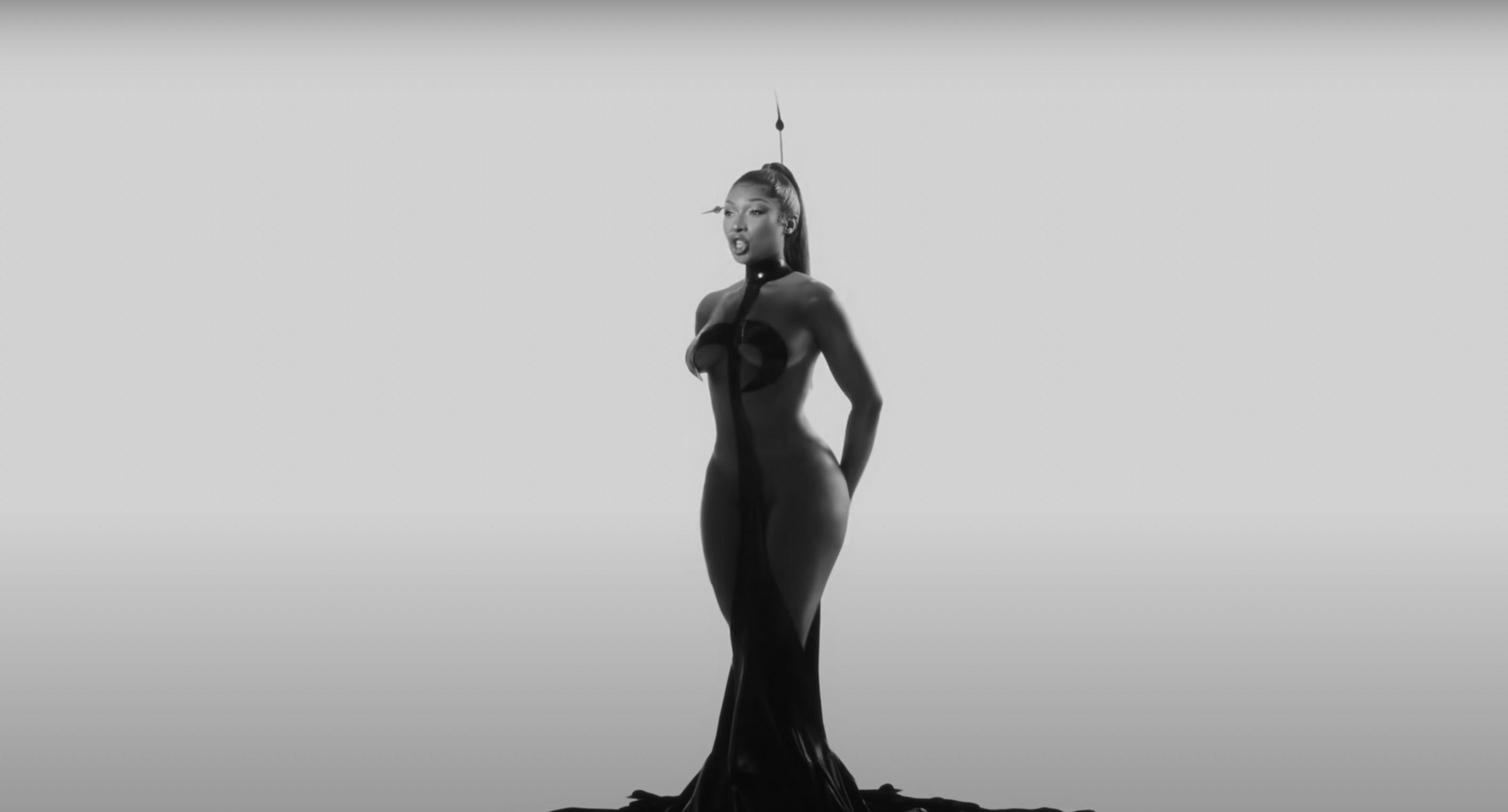 Meg Thee Stallion&rsquo;s new music video features cutout bodysuits, booty shorts, and more.