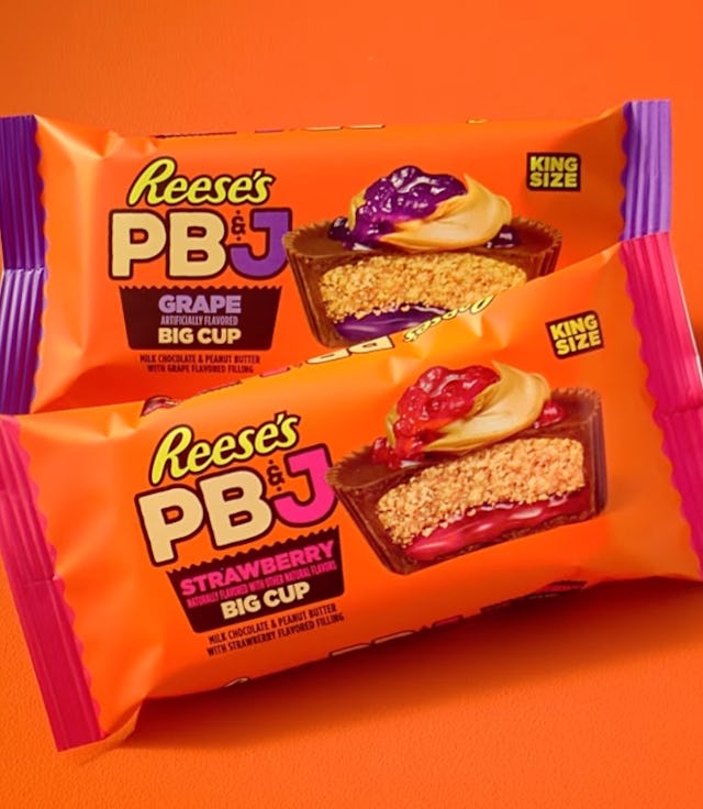 Reese’s PB&J Big Cups -- one strawberry and one grape -- on an orange background.