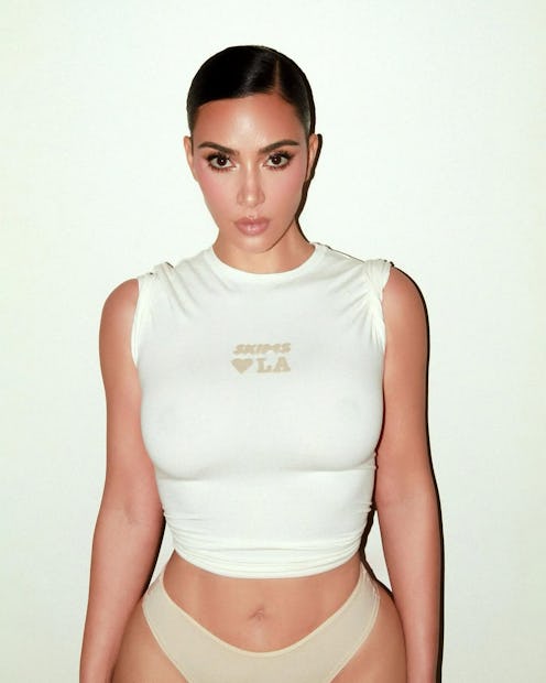 Kim Kardashian wears a white shirt and beige undies in latest "naked dressing" 'fit.