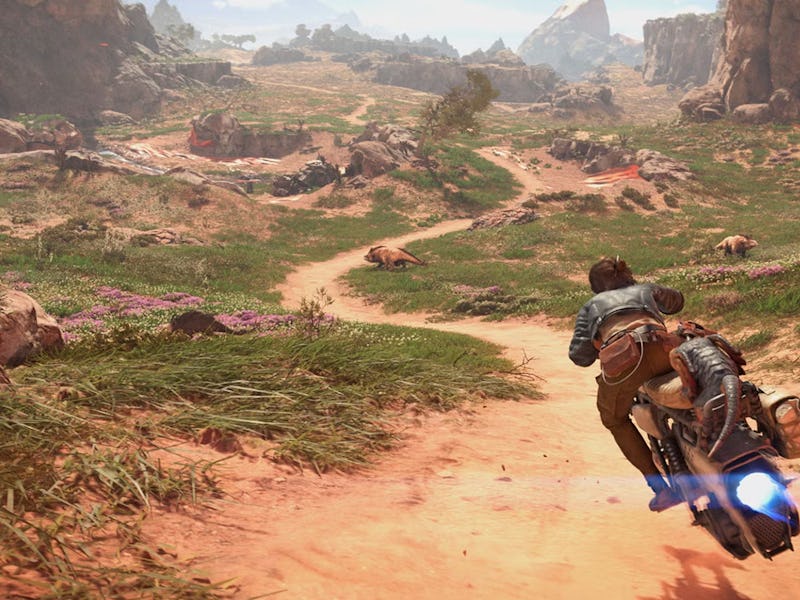 Kay Vess rides a speeder down a dirt path.