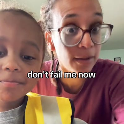 A woman with glasses and a child in a safety vest are close to the camera, both smiling. Text overlay says, "don't fail me now," indicating a playful moment.