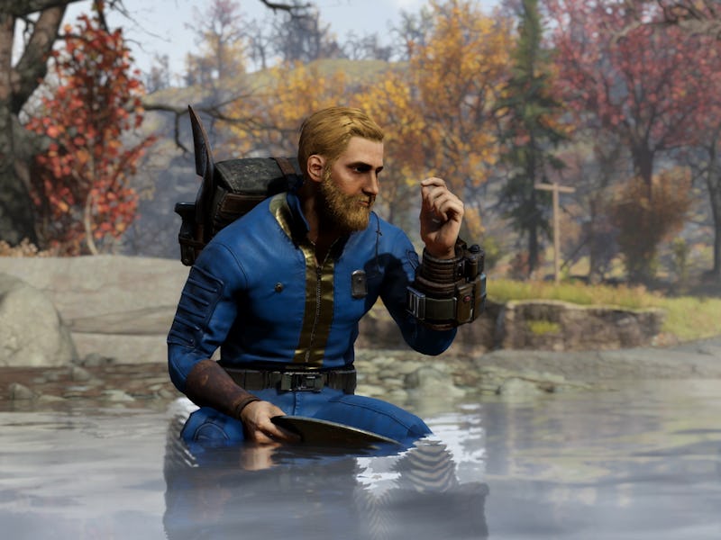 A bearded man in a blue outfit kneels in a misty pond, holding a metal pan. Colorful autumn trees fr...