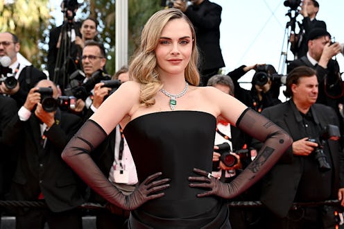 Cara Delevingne sported gothic glam and black hair with blunt bangs at Cannes.
