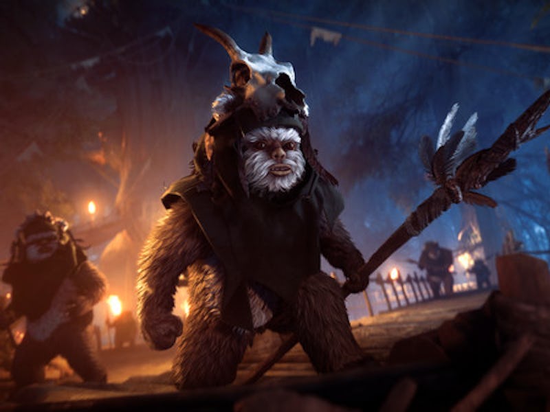 Ewoks holding a spear, set in a dark forest lit with torches.