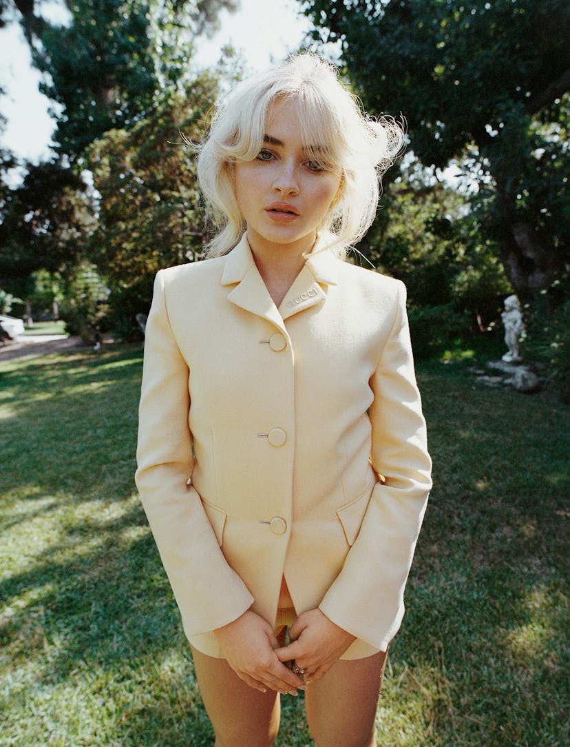 Sabrina Carpenter wears a butter yellow Gucci jacket and shorts