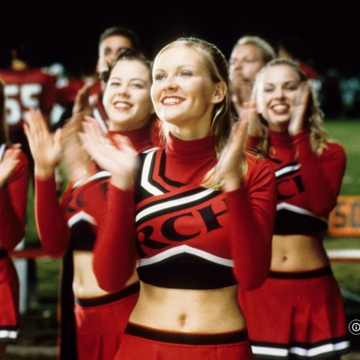 Kirsten Dunce as Torrance leads the Toros in a cheer in Bring It On, an iconic 2000s teen movie.