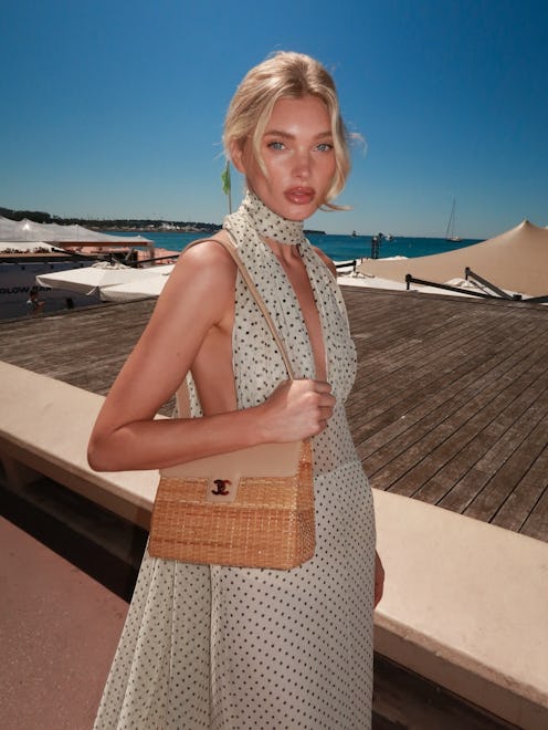 Elsa Hosk wears a plunging polka dot chiffon dress.