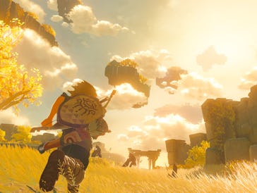 Link runs along a sky island towards a brightly lit arch in the distance.