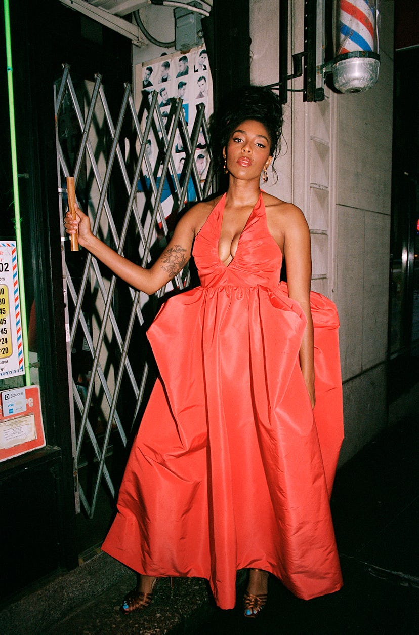 Jessica Williams wears a red Christopher John Rogers dress