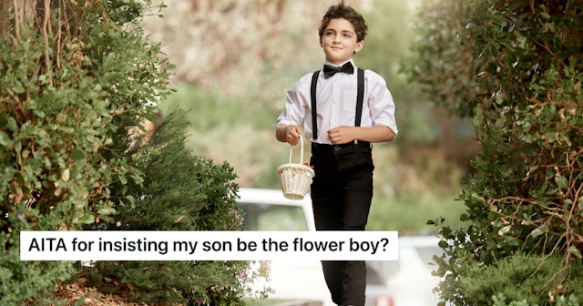 A young boy in a tuxedo and bow tie walks down a path, holding a small basket. Greenery surrounds hi...