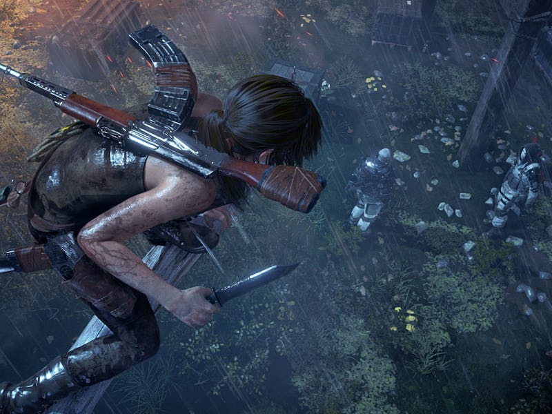 Lara Croft stalks two enemys from a tree branch hanging above.
