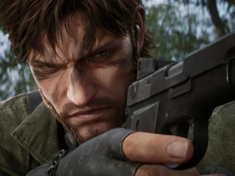 Naked Snake holds a pistol while in the Soviet jungles.