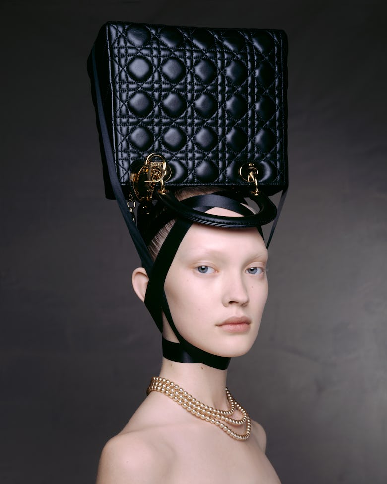 A model with a Dior Lady Bag on her head