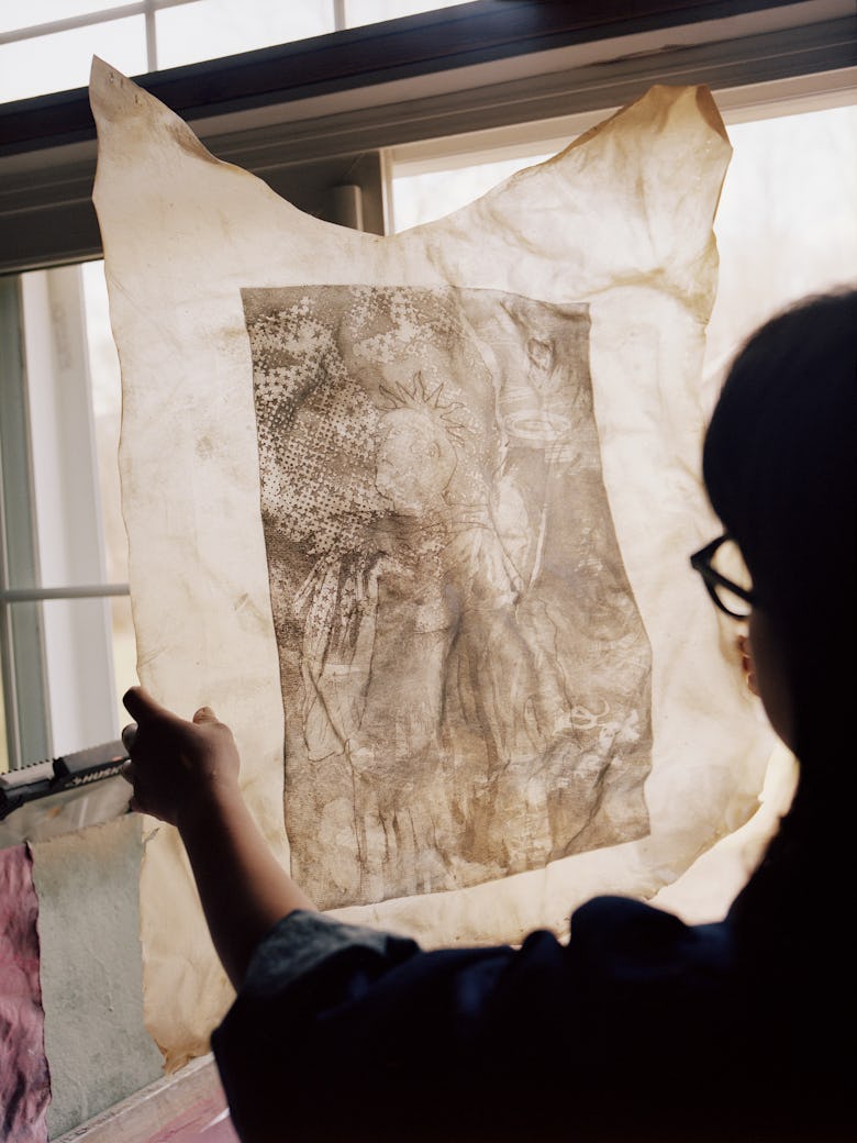 Nguyen holding a sketch
