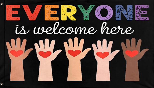 A banner featuring the phrase "EVERYONE is welcome here," with colorful lettering and five diverse h...