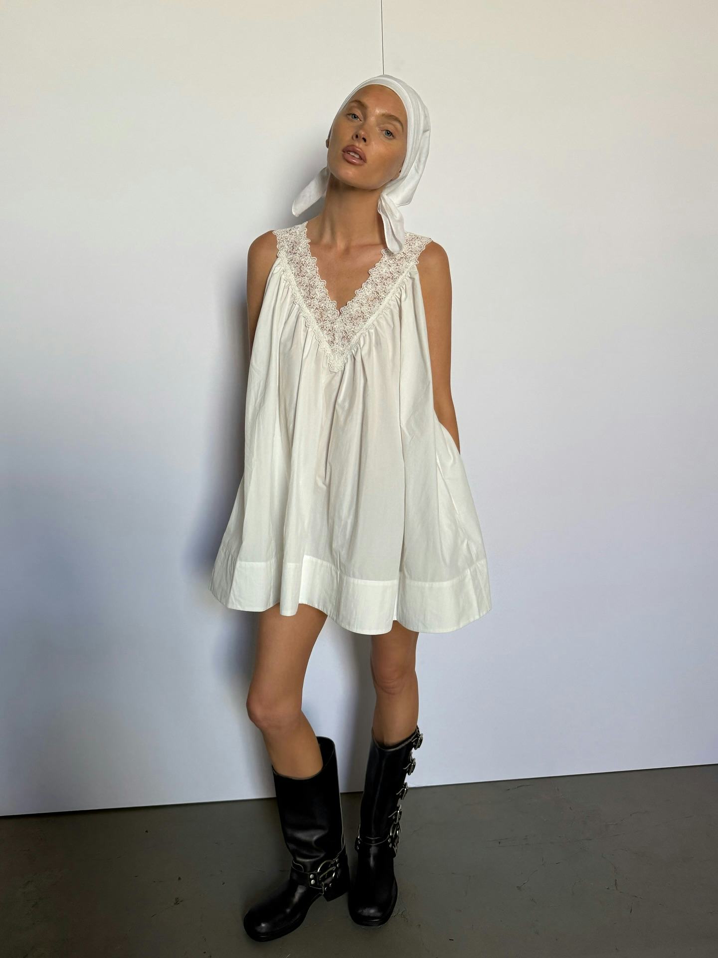 Elsa Hosk wears a white dress.   