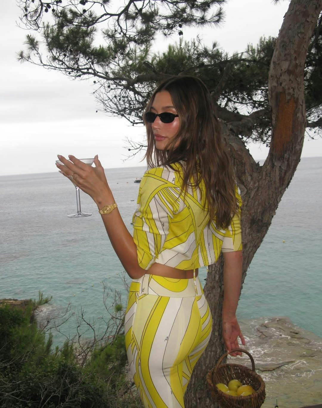  Hailey Bieber matched her microbikini to her new Rhode Lemontini Peptide Lip Tint.