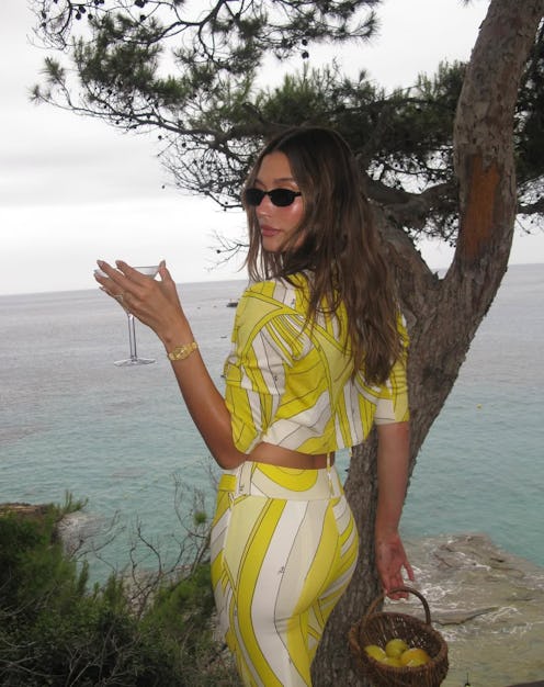 Hailey Bieber matched her microbikini to her new Rhode Lemontini Peptide Lip Tint.