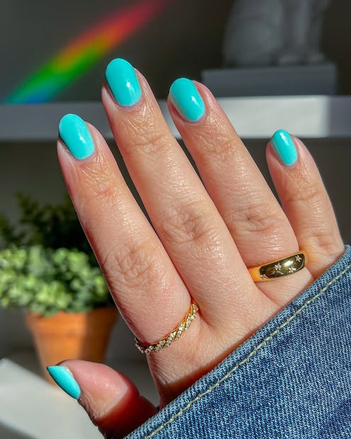 "Millennial teal" nail art is big for summer 2025.