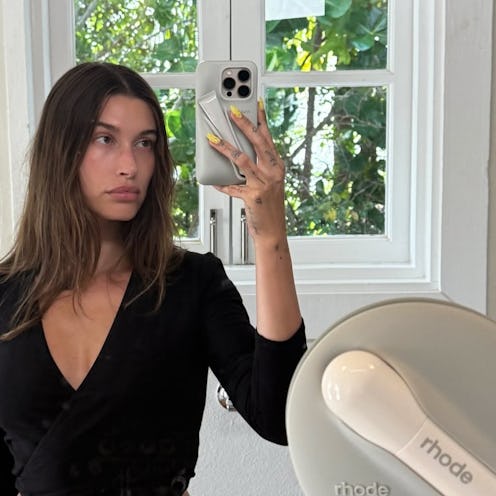 Hailey Bieber with yellow almond-shaped nails