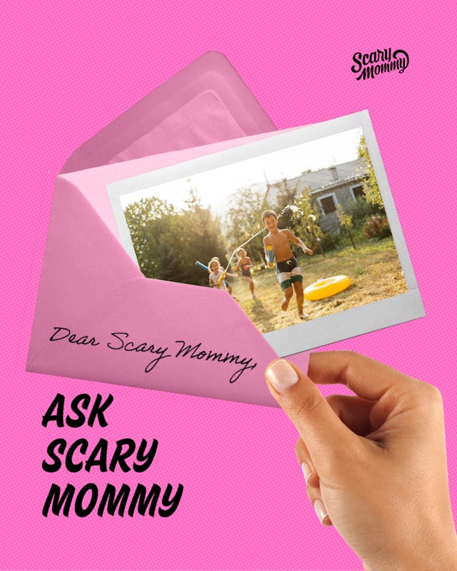 A group of kids playing with water guns in a backyard.