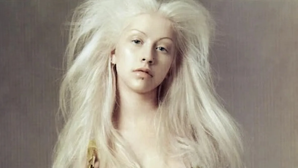 22 Years Later, Christina Aguilera Rewears Her Iconic Versace Lace-Up Gown 22 Years Later, Christina Aguilera Rewears Her Iconic Versace Lace-Up Gown