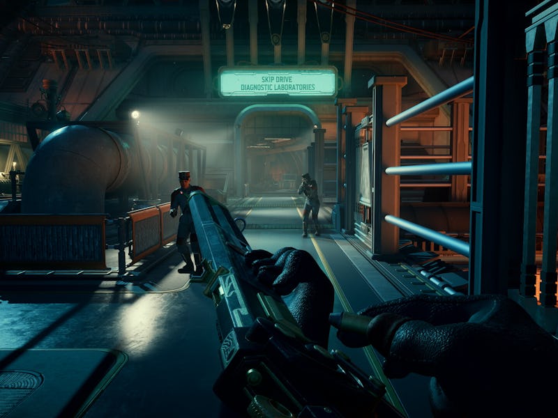 A hand grips a futuristic weapon in a dimly lit industrial corridor, with machinery in the backgroun...