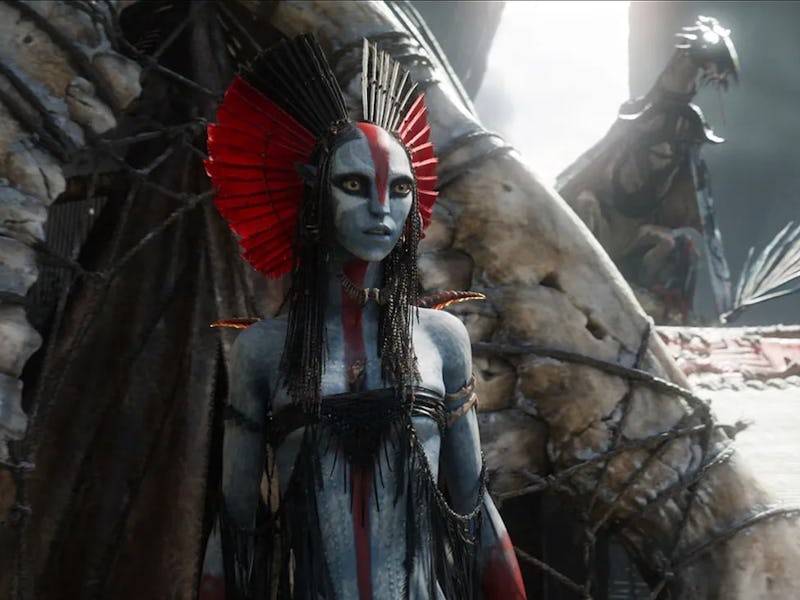 A character with blue skin and elaborate red and black face paint stands confidently, adorned with s...